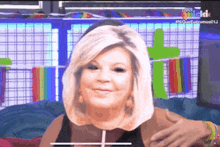a woman with blonde hair is wearing a mask on her face