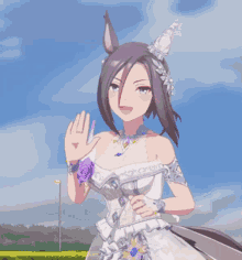 a woman in a white dress with a purple flower on her wrist