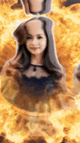 a woman is surrounded by flames and smoke