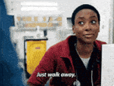 a woman in a red jacket says just walk away