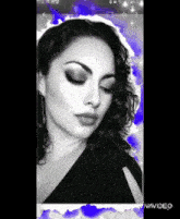 a black and white photo of a woman with vivavideo written on the bottom right corner
