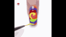 a close up of a person 's nails with a colorful design on them