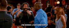 a group of people are dancing in a bar and one man says i 'm gonna live forever !!!