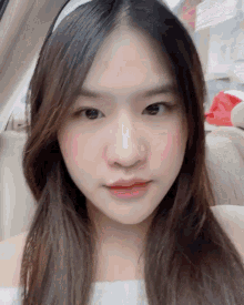 a close up of a girl 's face with a white headband