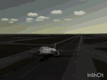 a nasa airplane is taking off from an airport runway at night