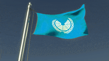 a blue flag with a white circle on it is flying in the wind