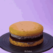 a cake on a plate that says mr.cakes on the bottom