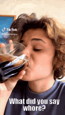 a woman drinking a glass of coke with a caption that says what did you say whore