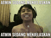 a shirtless man wearing headphones with the words atmin sedang menjelaskan atmin sedang menjelaskan