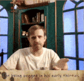 a picture of a man with the words " for being pegged in his early thirties " below him