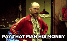a man in a red jacket with the words pay that man his money above him