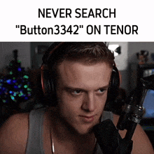 a man wearing headphones is sitting in front of a microphone with the caption " never search " button3342 " on tenor