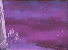 a man and a woman are standing next to each other in a purple background .