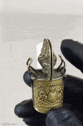 a close up of a person holding a lighter that says army prisoner
