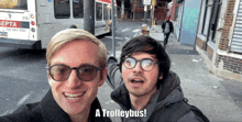 two men are posing for a picture with the words a trolleybus below them