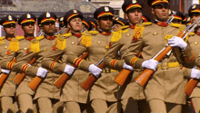 a group of soldiers marching in a line holding their guns