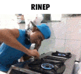 a man in a blue hat is fixing a stove with the word rinep above him