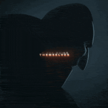 a man and a woman are standing in front of a fire with the letter s visible