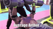 a man is lifting dumbbells in a gym with the words average arthur on the bottom