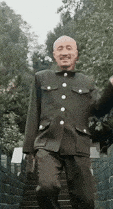 a man in a military uniform is walking up stairs