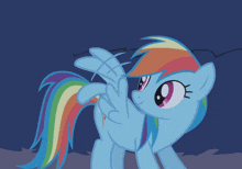 a blue pony with a rainbow mane and tail is looking at something