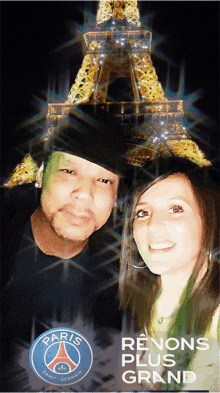 a man and a woman are posing in front of the eiffel tower and the words renons plus grand