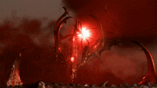a red light is shining on a strange looking object