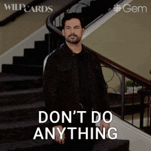 a man standing on a set of stairs with the words do n't do anything