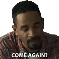 a man in a plaid shirt says come again with his eyes closed