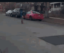 a man is walking down the street with a skateboard
