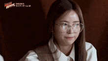 a woman wearing glasses and a white shirt with the word race on it