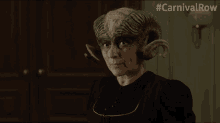 a woman with horns on her head and the hashtag carnivalrow