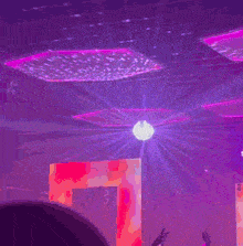 a purple background with a bright white light coming out of it