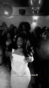 a black and white photo of a woman dancing with the caption clearly my favorite song on this album