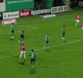 a soccer player with the number 21 on his back is running on the field