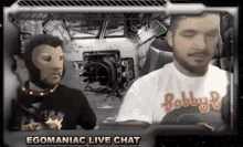 two men are sitting in front of a screen with the words egomaniac live chat on it