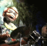 a puppet wearing sunglasses is playing drums