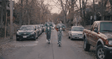 scooter neighborhood strolling along group gang