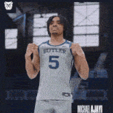 a man in a butler 5 jersey stands on a court