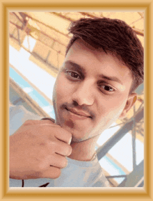 a man with a mustache is taking a picture of himself