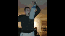 a man is throwing a frisbee in the air while holding a remote control