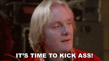 a man in a red jacket says it 's time to kick ass ..
