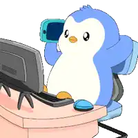 a blue and white penguin is sitting in front of a computer screen
