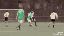 a group of soccer players are playing a game on a field .