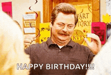 a man with a mustache is standing in front of a sign that says `` happy birthday ! ''