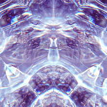 a close up of a purple and blue kaleidoscope with a face in the middle
