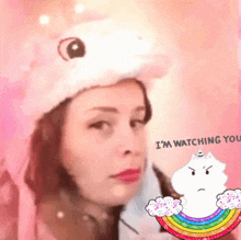 a woman wearing a unicorn hat with the words i 'm watching you