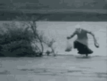 Man Jumping In Water Dancing In The Flood GIF