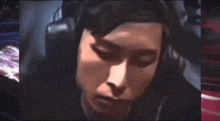 a close up of a person wearing headphones on a video call .