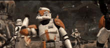 a group of stormtroopers are standing in a dark area